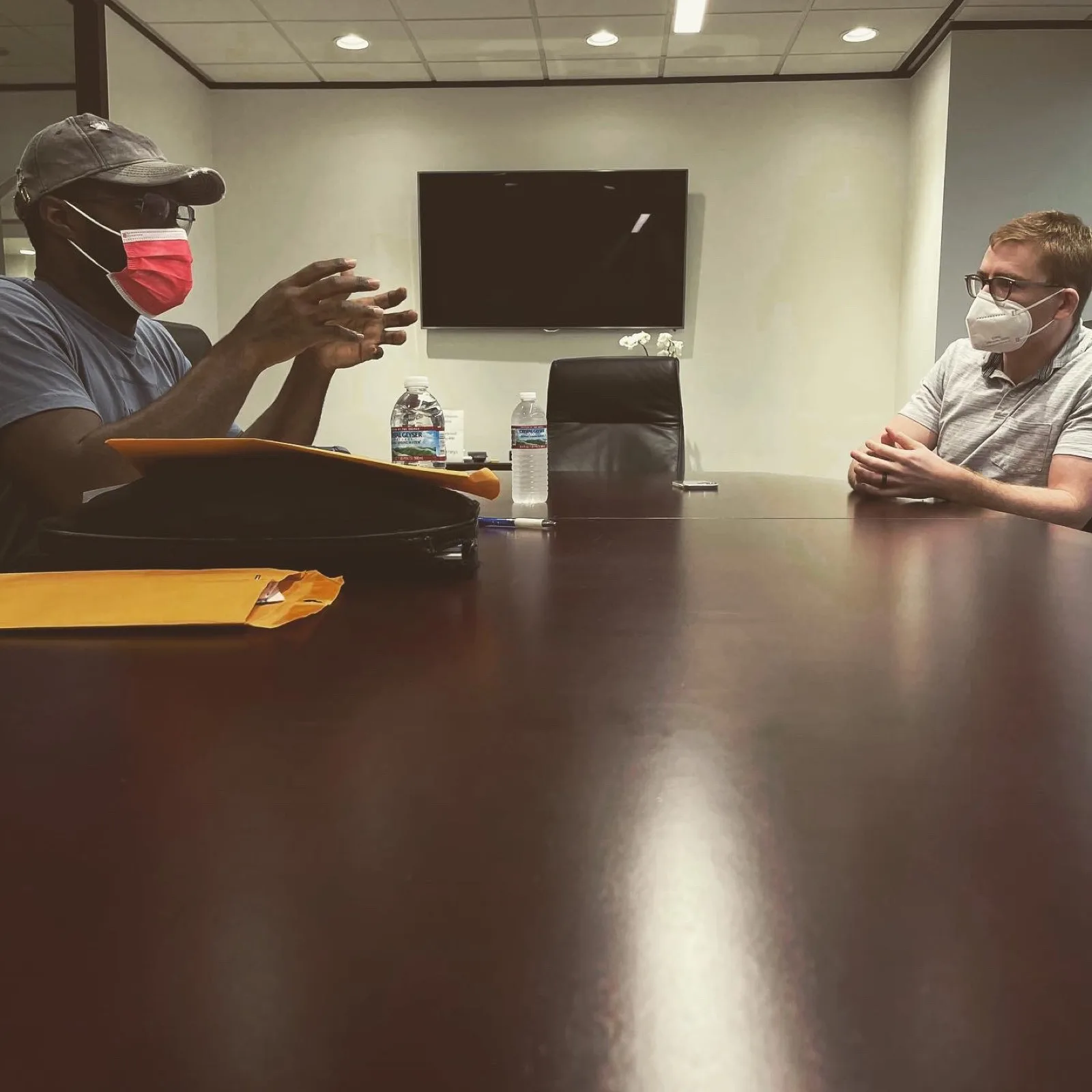 A client explaining his case to a VB Attorneys lawyer across a conference table