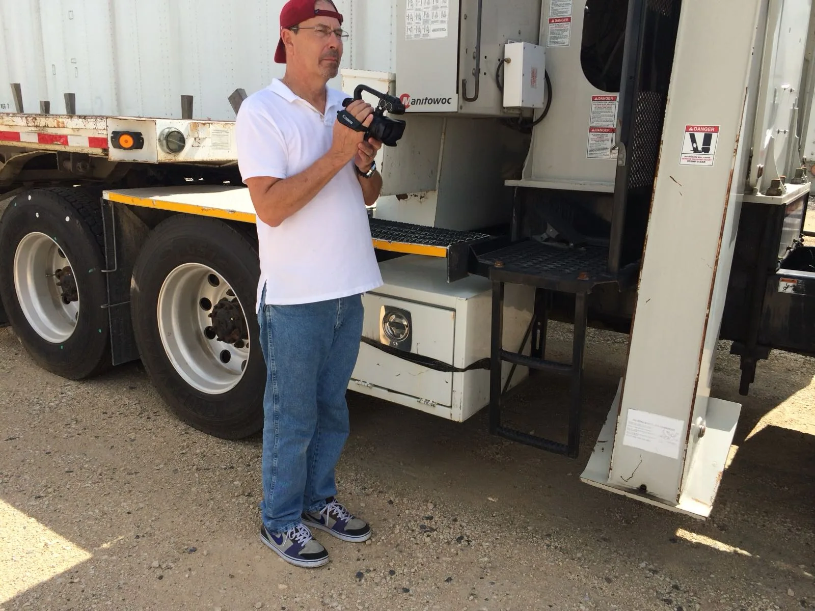A VB Attorneys lawyer photographing a commercial truck during a vehicle inspection