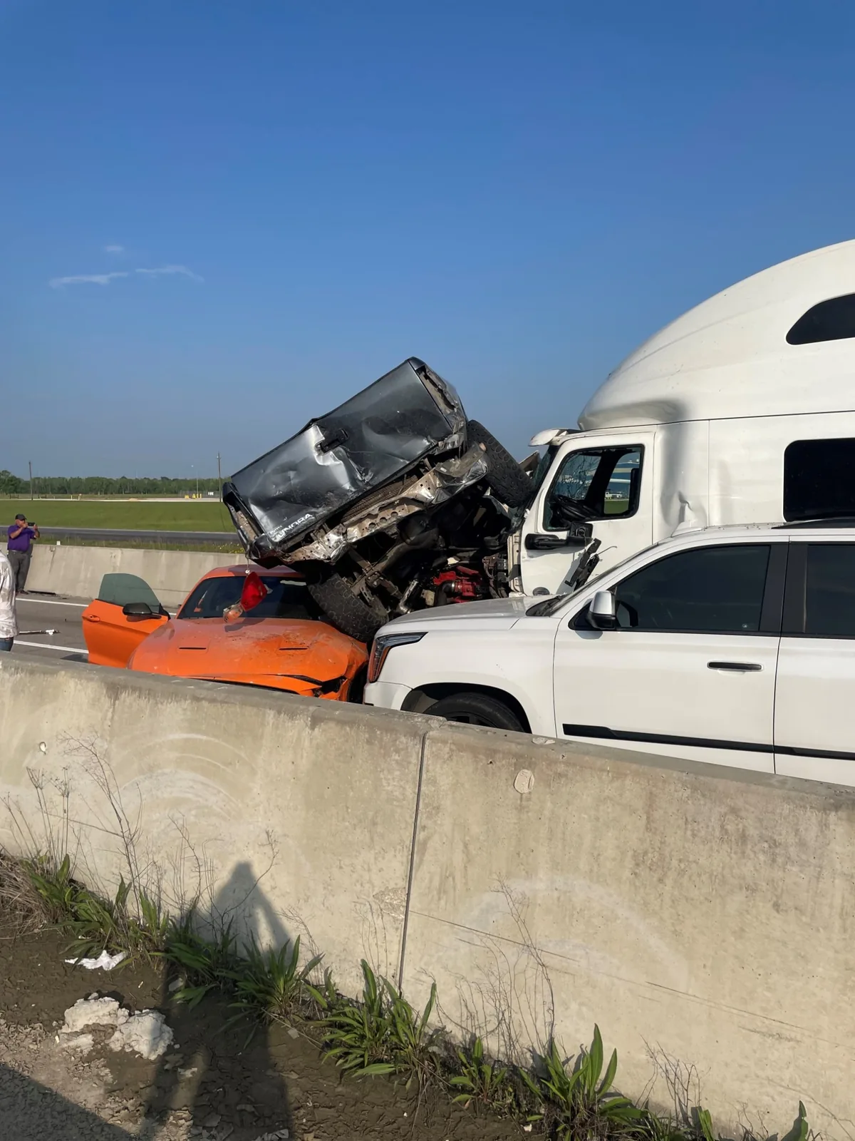 A pickup truck thrown onto a car beside a tractor-trailer at the multi-vehicle crash scene in Rogers v. Anheuser-Busch
