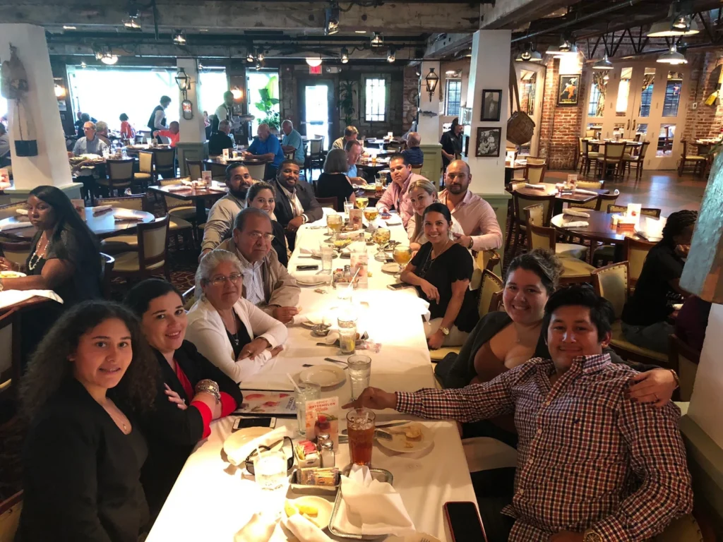 The Barron family gathered around a long restaurant table for dinner.