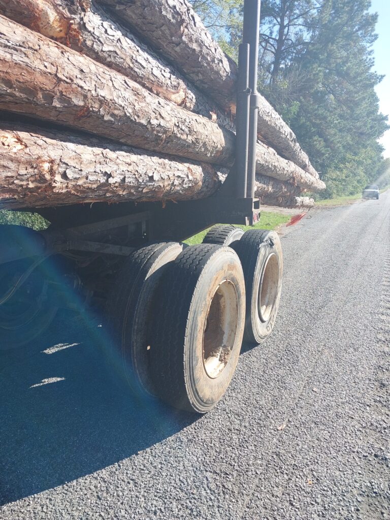 The loaded logging trailer involved in the collision.