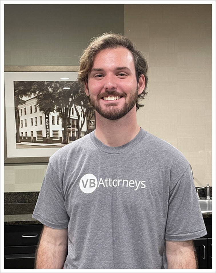 Landen T. wearing a gray VB Attorneys T-shirt.