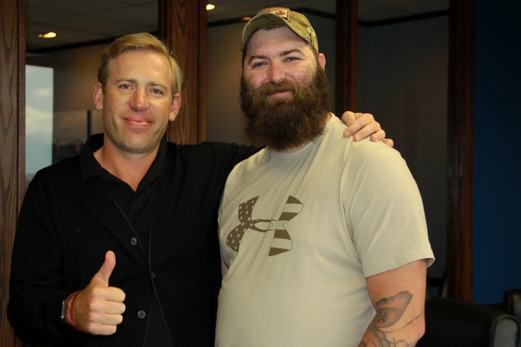 Brian Beckcom standing with Tim M.