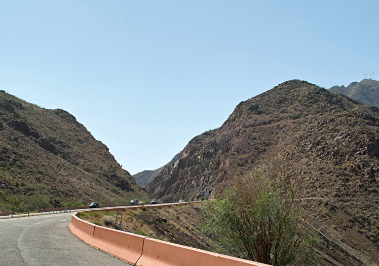 Transmountain Road curves between rocky slopes in El Paso’s Franklin Mountains.